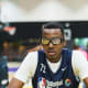 Christian Koloko, the Toronto Raptors' 2022 second-round pick, holds a glass of water at the 2018 Basketball Without Borders event in Los Angeles